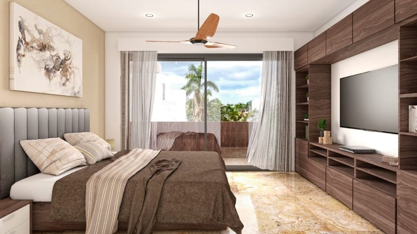 Bedroom with king size bed in front of furniture wall and balcony at Green Savage