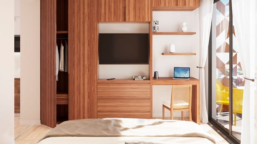 Wall furniture with TV in the bedroom at Vibbe Luxury Condos