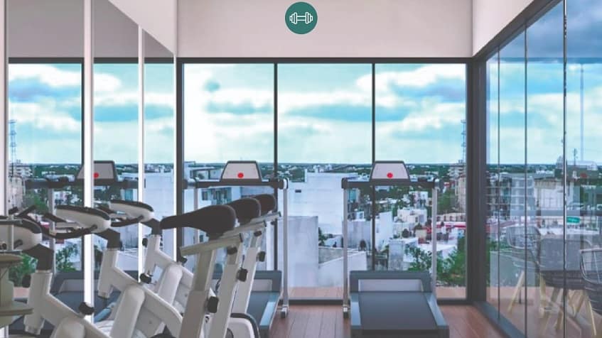 Gym with glass walls and town view at Green Savage