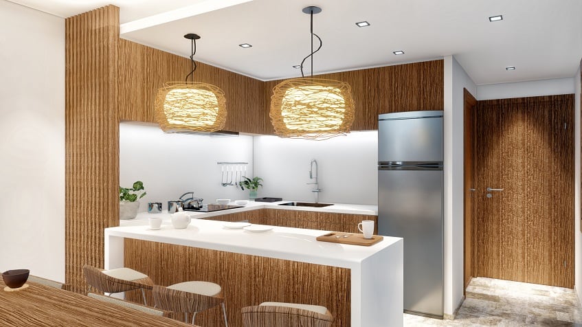 White and wooden color kitchen at Amira District