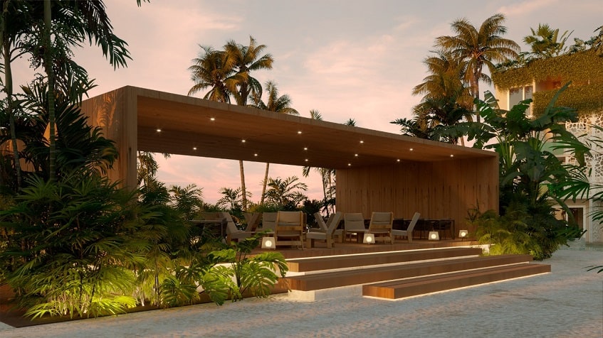 Outdoor dining under a wooden roof structure at Ocean Tulum