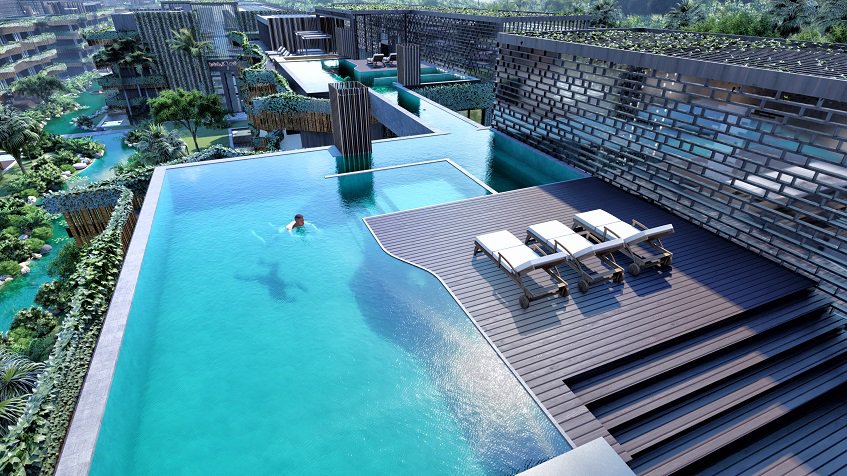 Rooftop pool and a person swimming at Amira District