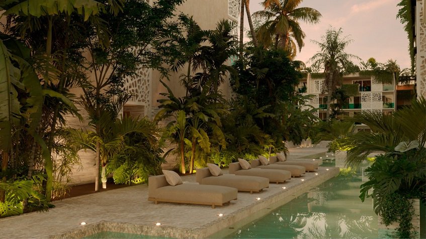 Residential building facade and pool garden with solarium at Ocean Tulum