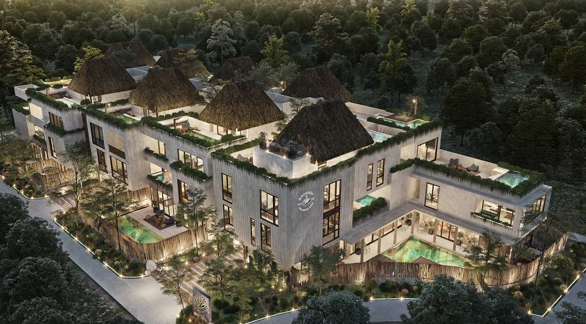 Top view of residential building with palapas on the rooftops and groundfloor pool at Mestiza Tulum