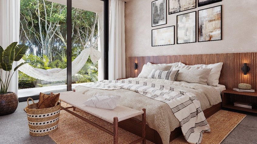 Bedroom with a hammock on a terrace surrounded by vegetation at Talulah Tulum