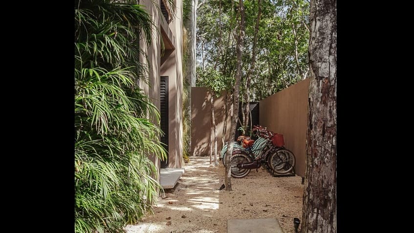 Bicycle parking next to the residential building at Zanza Tulum