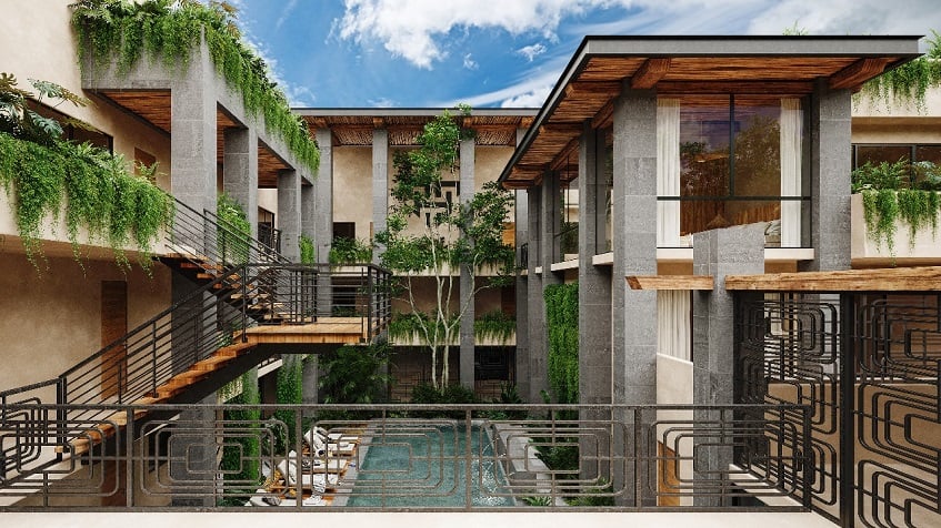Residential building facade with a staircase going from the top to the garden pool at Talulah Tulum