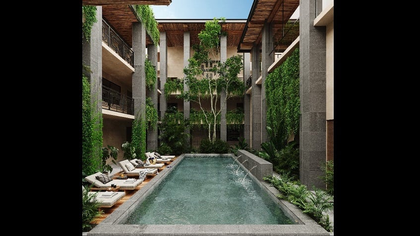 Residential building with a pool and solarium in the middle surrounded by vegetation at Talulah Tulum