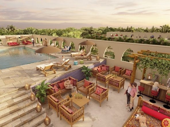 Rooftop pool with lounge area and bar at Mistiq Plaza Los Arcos
