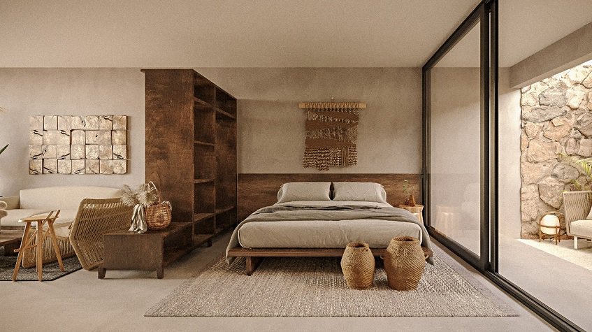 Bedroom and living room divided by wooden furniture at Selva Ambar Tulum