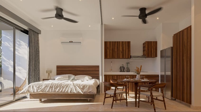 Studio interior with a bed next to a kitchen at Lik Zama