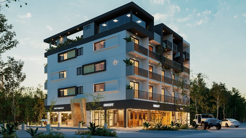 Corner view of residential building with commercial shops on ground floor, night time at Lik Zama