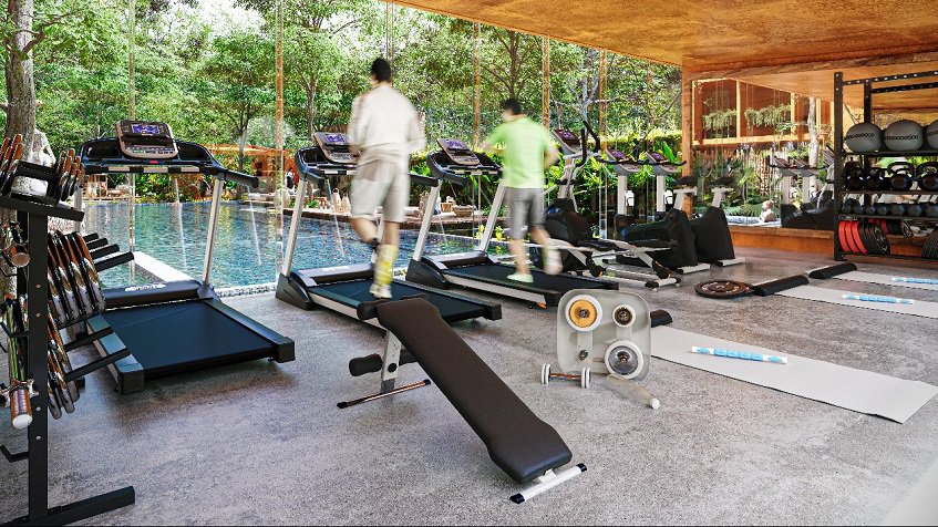 Gym room with a large window and view of a pool, two men on treadmill at Kune Tulum