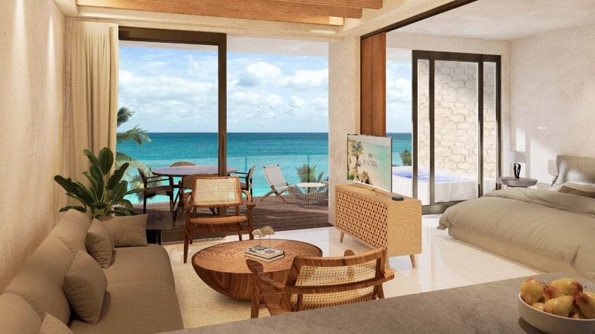 Living room and bedroom divided by folding screen, oceanview at Kaoba Tulum
