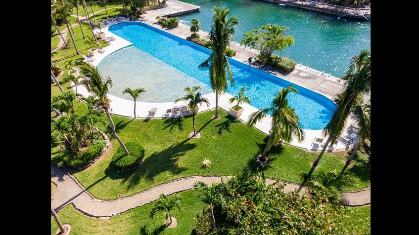 Top view of long blue pool next to Marina Dock at Secret Waters