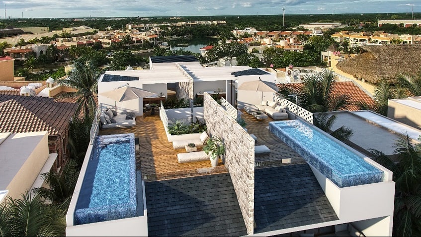 Residential building rooftops, one with two pools at Casacun Puerto Aventuras
