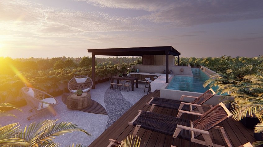 Rooftop garden with a pool and bar surrounded by vegetation at Homa Kah Tulum