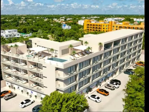 Aerial view of building with parked cars in Ukana Playa del Carmen