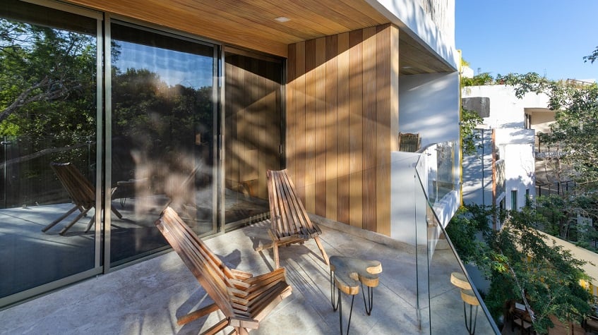 Terrace with two chairs and table at Gaia Residence