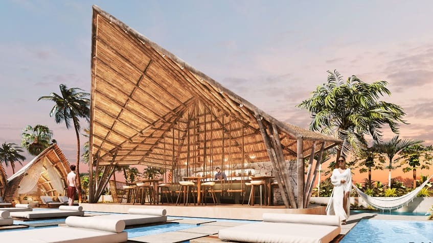 Bar under a huge palapa and pool at Sofia Tulum