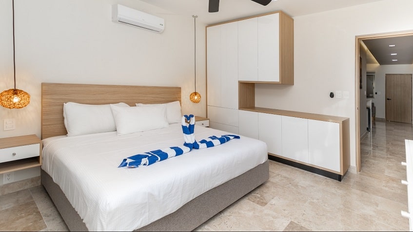 Bedroom with a white furniture at Gaia Residence