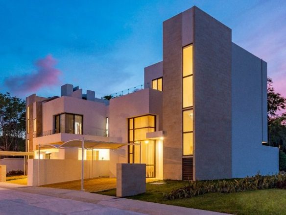 Illuminated house facade during a night at Monaco House | Bali at Riviera Maya