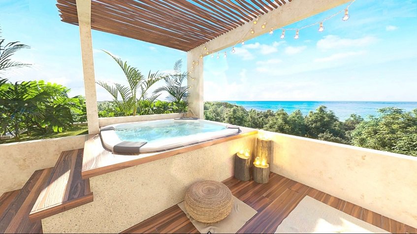 Rooftop jacuzzi with an ocean view at Caribique Playa del Carmen