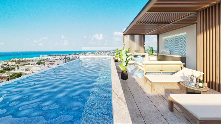Rooftop pool with a city and ocean view at Blu 38 Playa del Carmen