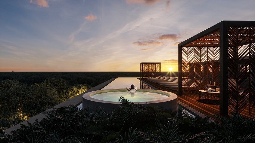 Rooftop pool and a woman in a round jacuzzi watching a sunset, solarium at Icht Tulum