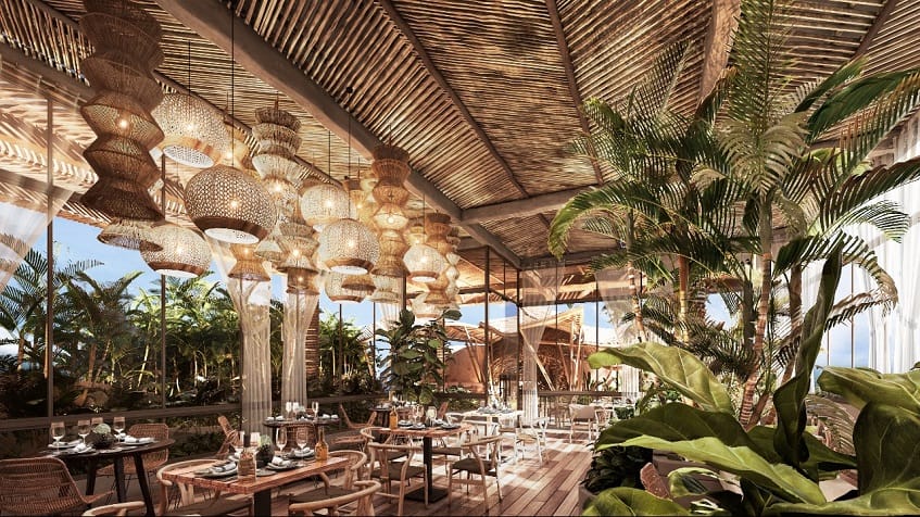 Restaurant with lots of hanging lamps, surrounded by vegetation at Sofia Tulum