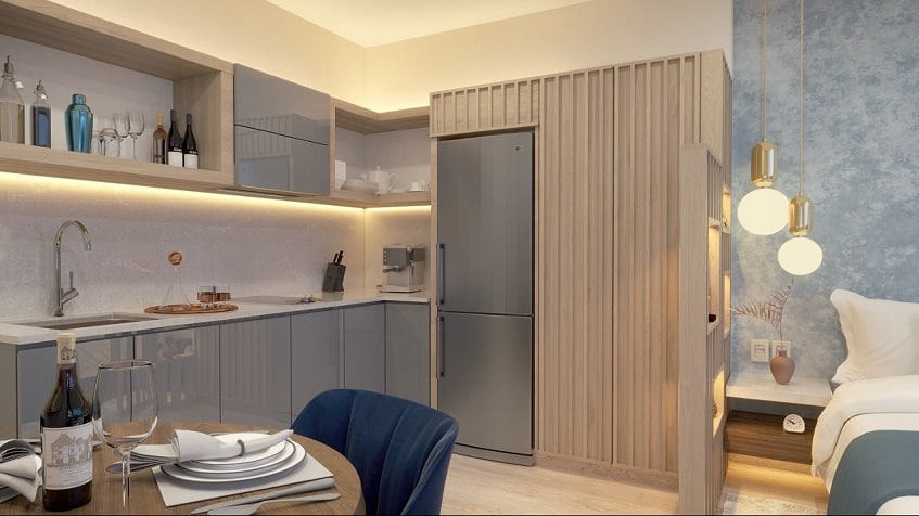 Kitchen with a grey built in fridge, bed at Blu 38 Playa del Carmen