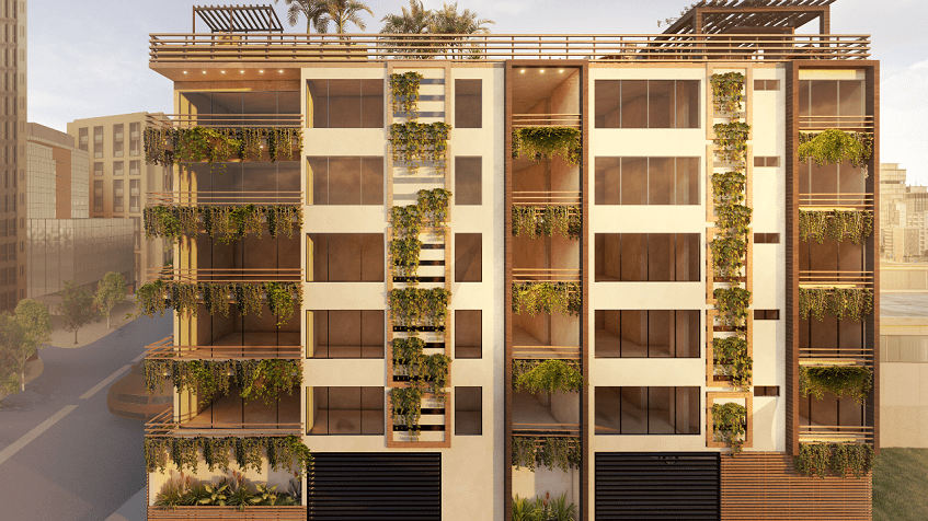 Residential building facade with green plants on balconies at Piedra Preciosa Residencial