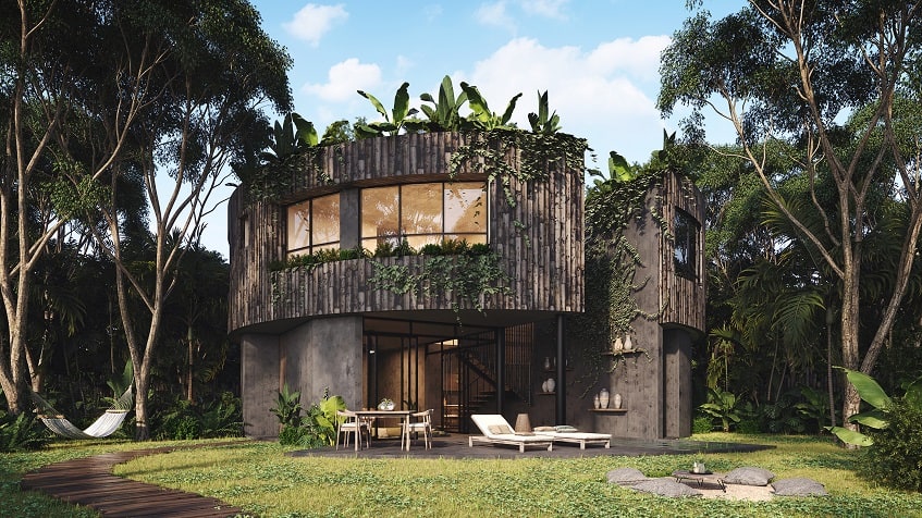 Facade of round residential building surrounded by vegetation, terrace, hammock at Esencia Villas Tulum
