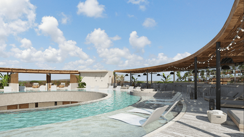 Rooftop pool in a circle shape, bar under a palapa at Tuk Origen Tulum