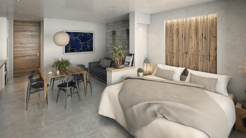 Apartment interior with a dining table and a bed at Blanko 54 Playa del Carmen