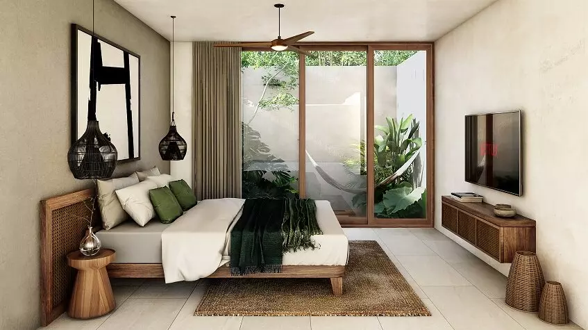 Bedroom with a bed in front of TV screen, window view for the hammock terrace at Retiro Tulum Artisan Homes