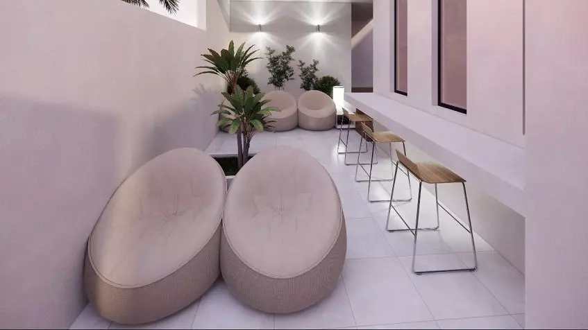 High stools by the white long bench, bean chairs at Sur 307 Condominios