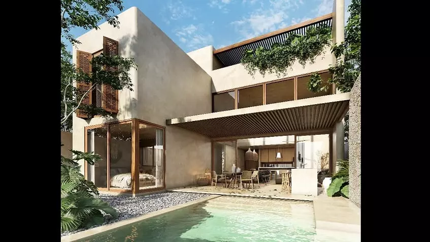 Pool terrace by a two level house facade at Retiro Tulum Artisan Homes