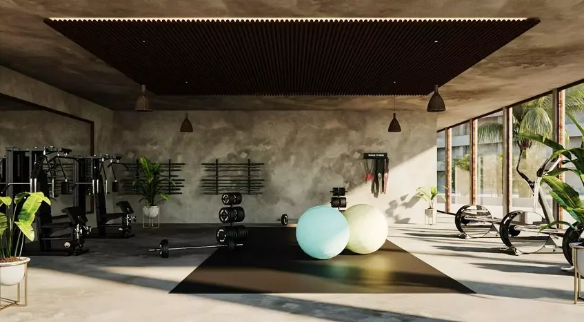 Gym room with weights, some exercise tools and two large balls at Macondo Hotel and Residences Tulum