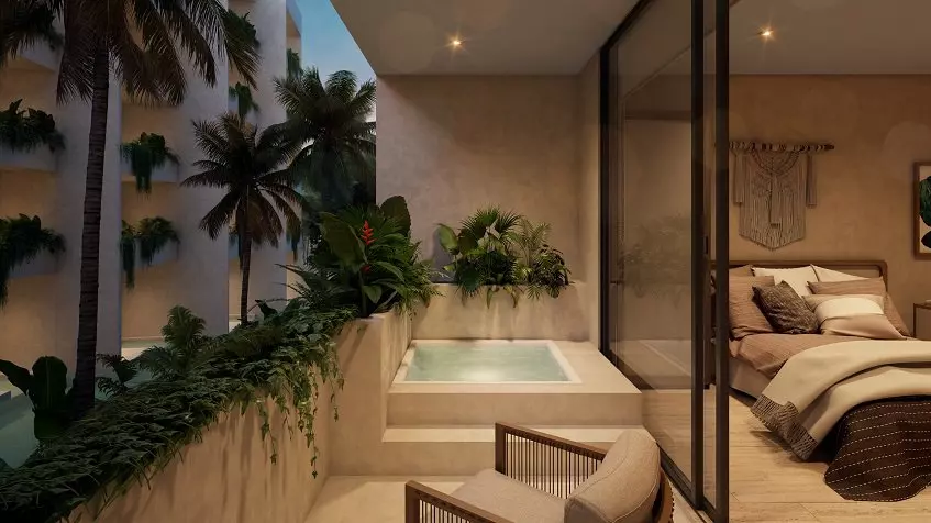Pool terrace surrounded by vegetation and a bedroom with a bed at Dalai DK Tulum