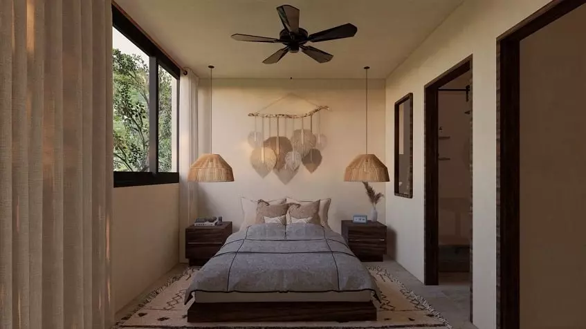 Bedroom with two side tables and small window and door at Sands Tulum