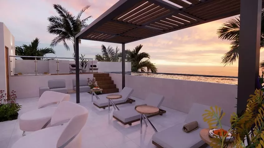 Sun beds deck, ocean view during a sunset at Sur 307 Condominios