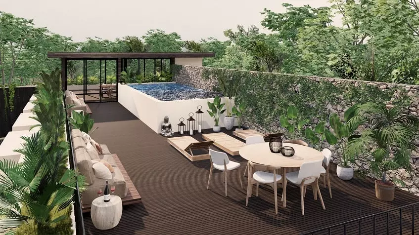 Rooftop with pool and sitting area surrounded by vegetation at Sands Tulum
