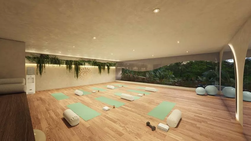 Large room with yoga matts on a wooden floor at Dalai DK Tulum