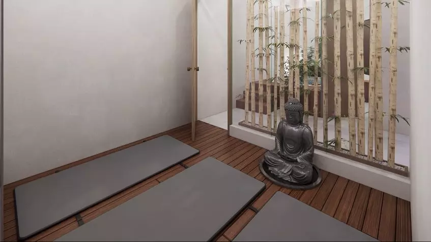 Yoga room with mats and buddha statue at Sur 307 Condominios