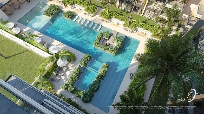 Top view for a pool and a garden, residential building at Origin by Wolf Cancun