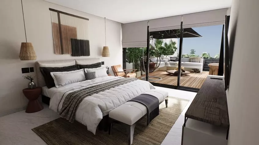 Bedroom with a king size bed in front of TV screen, large terrace at Ix Tulum Apartments