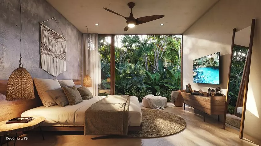 Bedroom with a bed in front of TV screen, mirror, terrace at Nequen Kukulkan Tulum