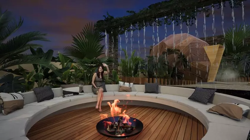 Fire pit and a sofa surrounding it in a circle, woman sitting at Ix Tulum Apartments