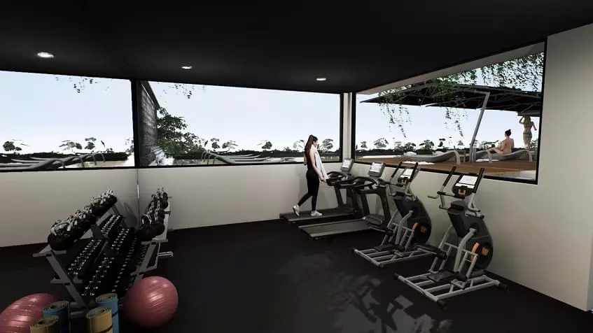Gym room and a woman with a towel doing exercise, pool behind a window at Ix Tulum Apartments